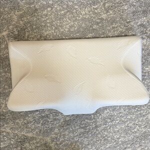 Contoured Cream Pillow for Enhanced Sleep